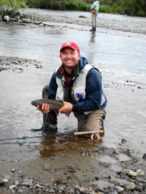 Scott with a rainbow trout taken in the Bristol Bay area ©Michelle Kaelke