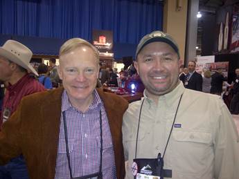 SAA Director Scott Hed visiting about Alaska with well-known hunting personality Craig Boddington (left) at the SHOT Show.